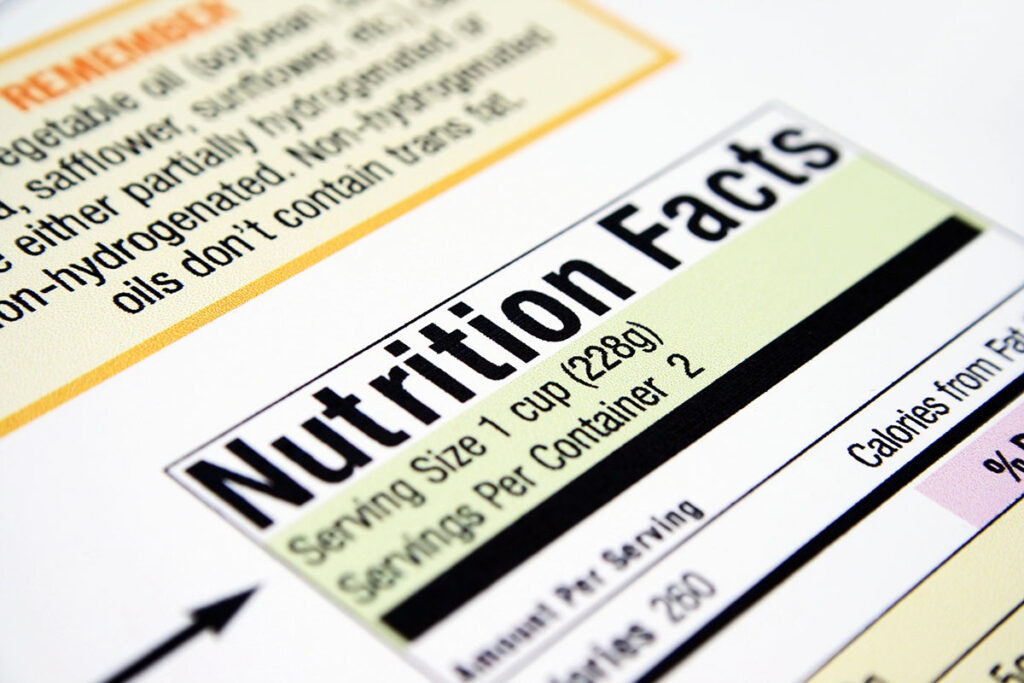 Close-up of a nutrition facts label, highlighting "Nutrition Facts," serving size of 1 cup (228g), and details on servings per container.