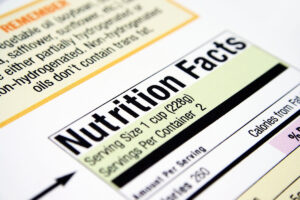 Close-up of a nutrition facts label, highlighting "Nutrition Facts," serving size of 1 cup (228g), and details on servings per container.